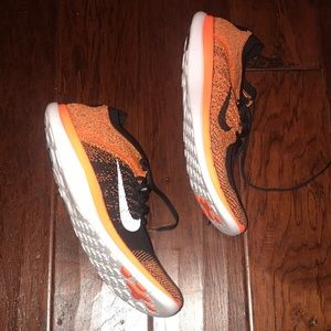 Orange and black Nike free flyknits